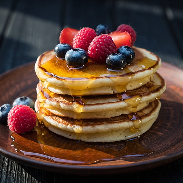 Warm Pancakes with Berries and Syrup